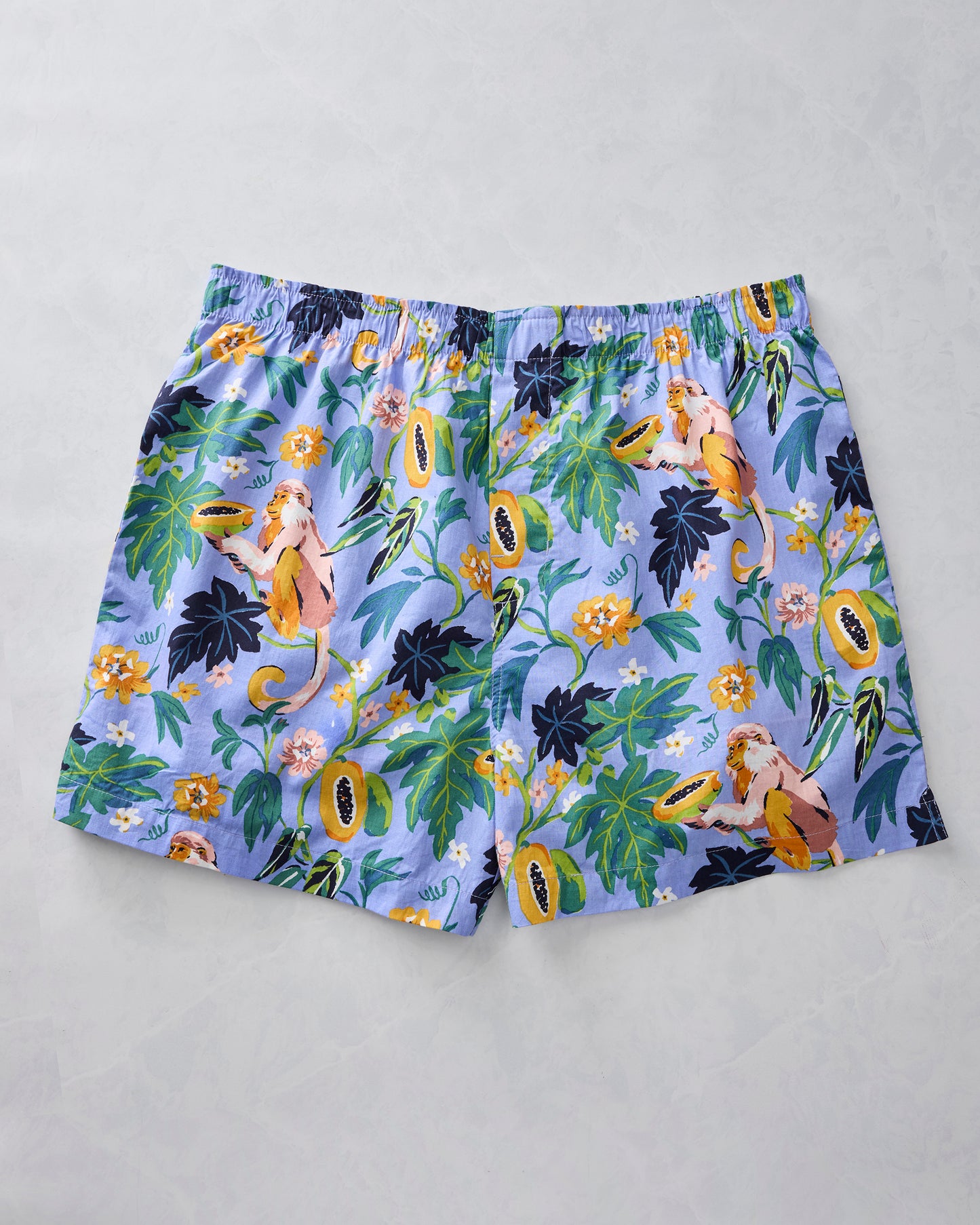 Periwinkle boxer shorts with monkeys, papayas, leaves, and flowers