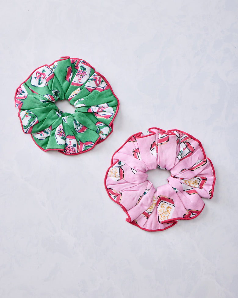 Green and peony pink Mah Jongg-print scrunchies arranged side by side