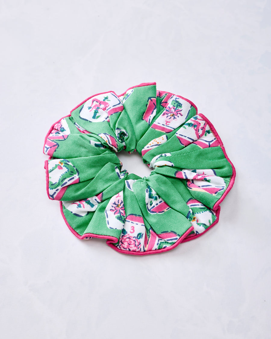 Green scrunchie with multicolored Mah Jongg tile print and pink edging
