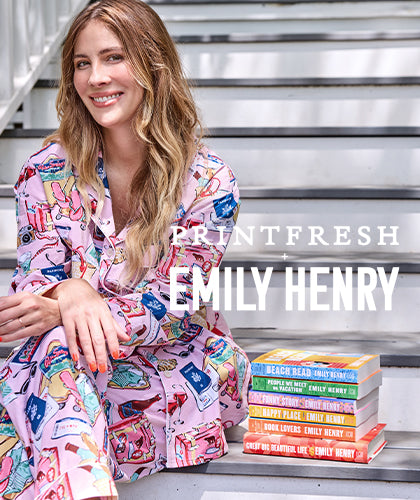 Printfresh Emily Henry collection featuring a woman in colorful printed pajamas seated beside Emily Henry books.