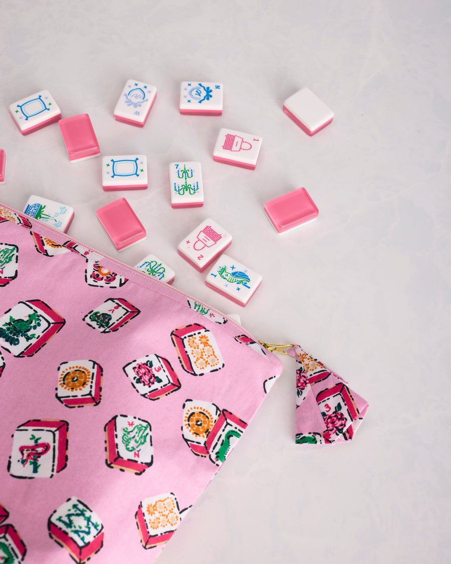 Close view of the Lucky Tiles pouch print, zipper, and matching pull tab beside Mah Jongg tiles