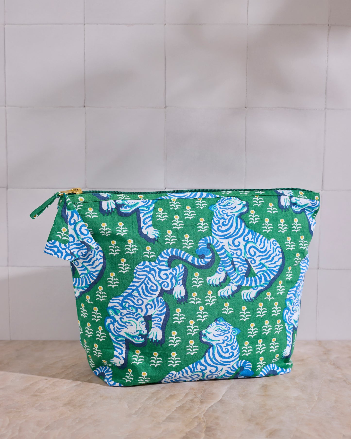 Tiger Queen essentials pouch in jade with a blue-and-green tiger print and top zipper.