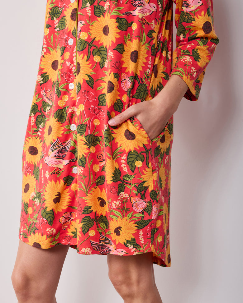 Close-up of the orange Autumn Sunflowers sleep shirt showing the lower buttons, side pocket, and hem.