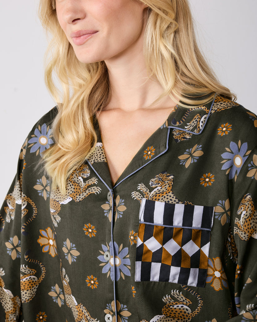 Close-up of the Rittenhouse set's notched collar, button front, and geometric-print chest pocket on the leopard-and-flower patterned top.