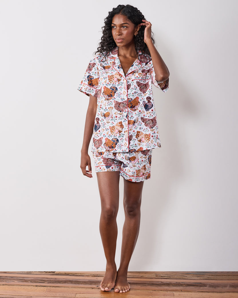 Full-length front view of a short chicken-print pajama set with a collared short-sleeve top and shorts.
