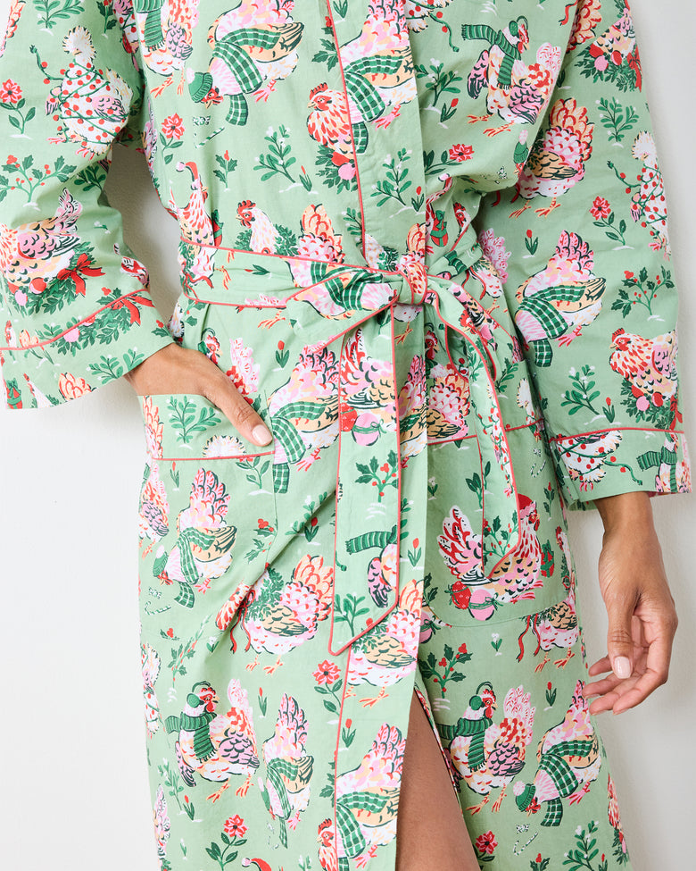 Close-up of the sage Holiday Hens robe showing the tied belt, front pocket, and hen print