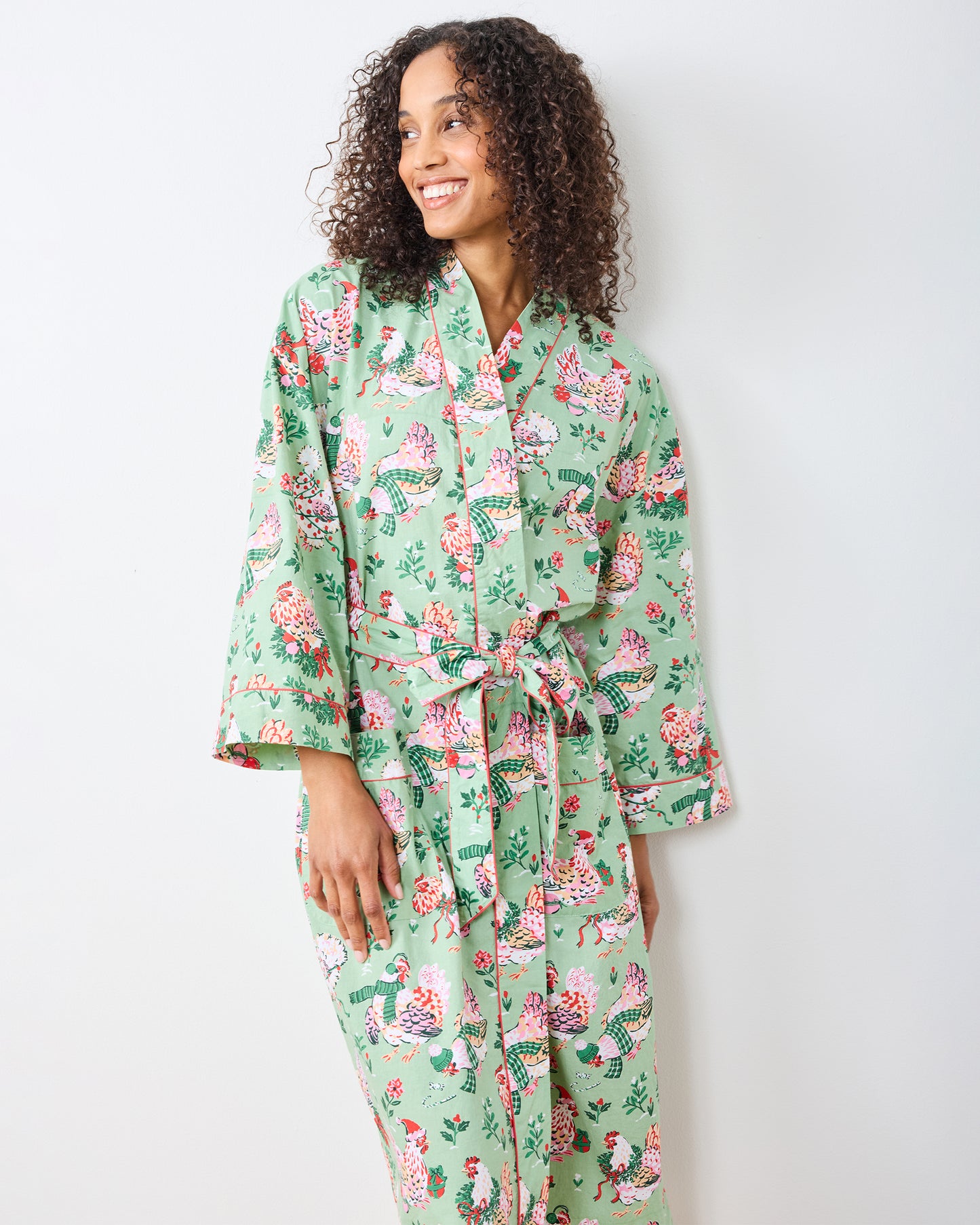 Front view of the sage Holiday Hens robe with a tied belt and front pockets