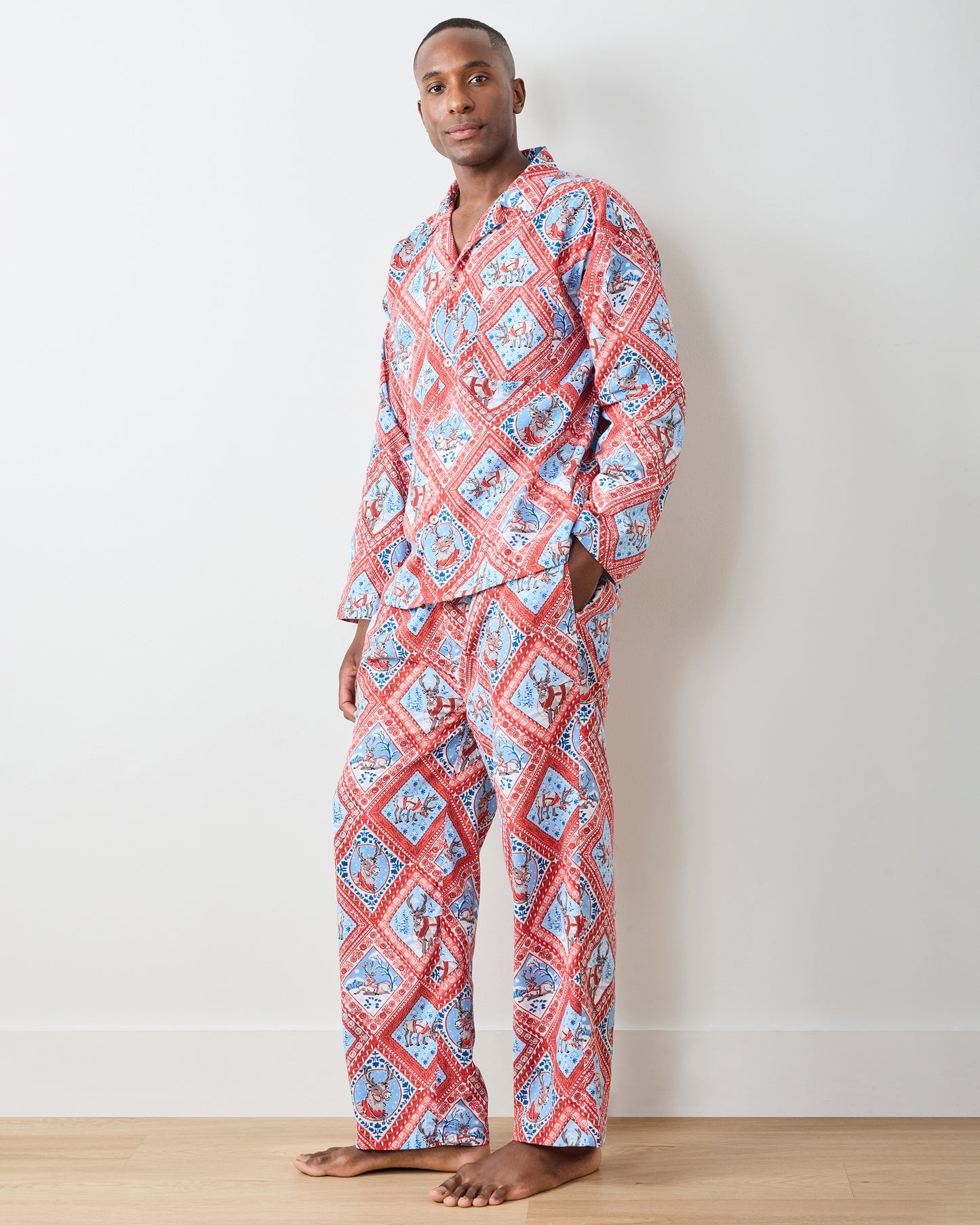 Front three-quarter view of Reindeer Games long pajama set with red framed reindeer print and button-front top