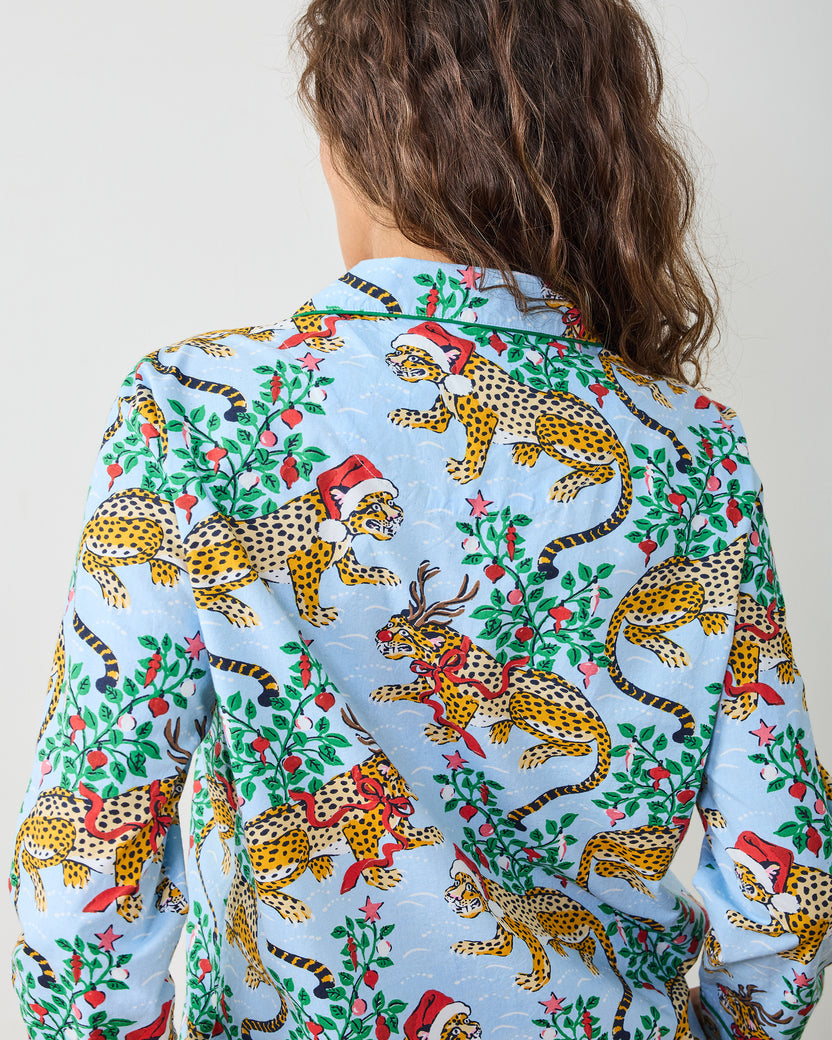 Close-up of the pale blue pajama top's holiday leopard print and back collar