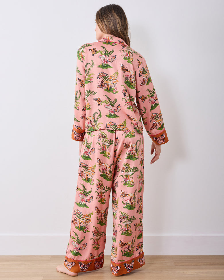 Back view of the pink Butterfly Forager pajama set, showing the patterned top, wide-leg pants, and contrasting cuffs and hems.
