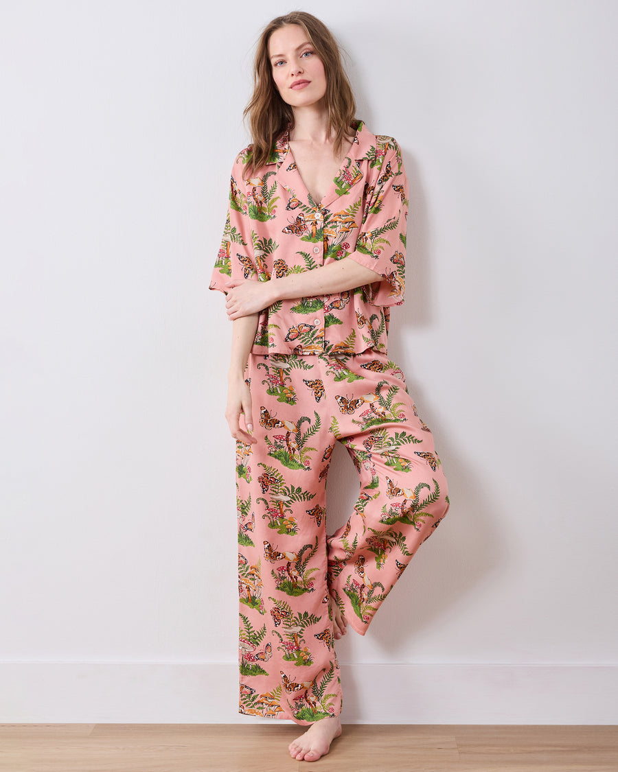 Full-length front view of the pink Butterfly Forager tall satin Wildest Dreams pajama set with a short-sleeved top and wide-leg pants.