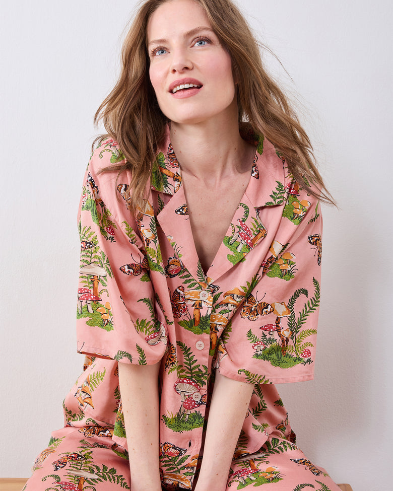 Front close-up of the pink Butterfly Forager tall satin Wildest Dreams pajama set showing the notched collar, buttons, and printed short-sleeved top.