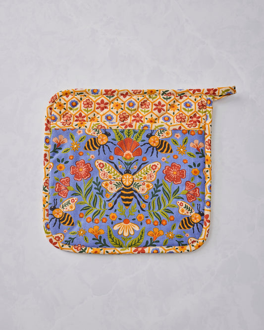 Bee Tapestry pot holder shown flat with a blue floral-and-bee center, cream floral-patterned border, and hanging loop.