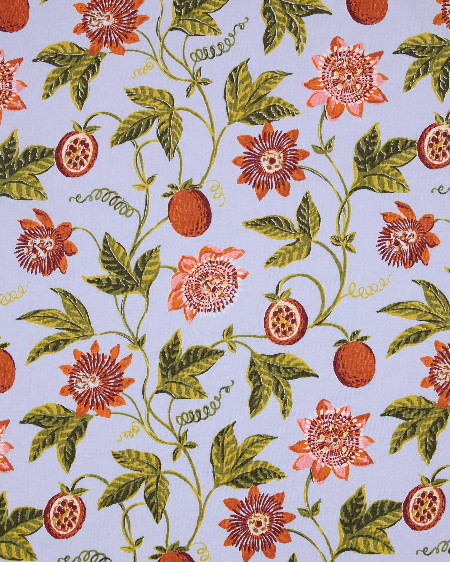 Passion Vine print with orange fruit, cut fruit, flowers, green leaves, and curling vines on a pale blue background