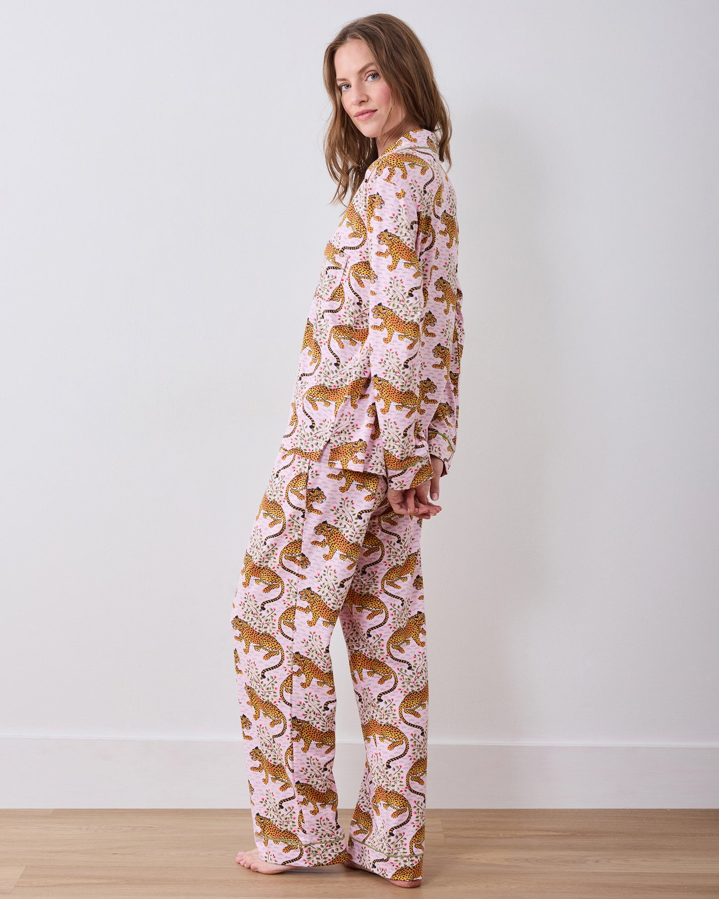 Side and back view of the Bagheera blush long pajama set with a button-down top, full-length pants, and leopard print.