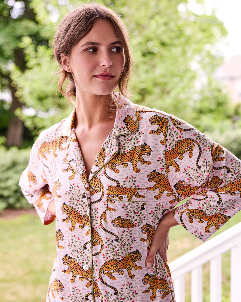 Close view of the blush Bagheera sleep shirt showing its leopard print, floral details, collar, and piping.