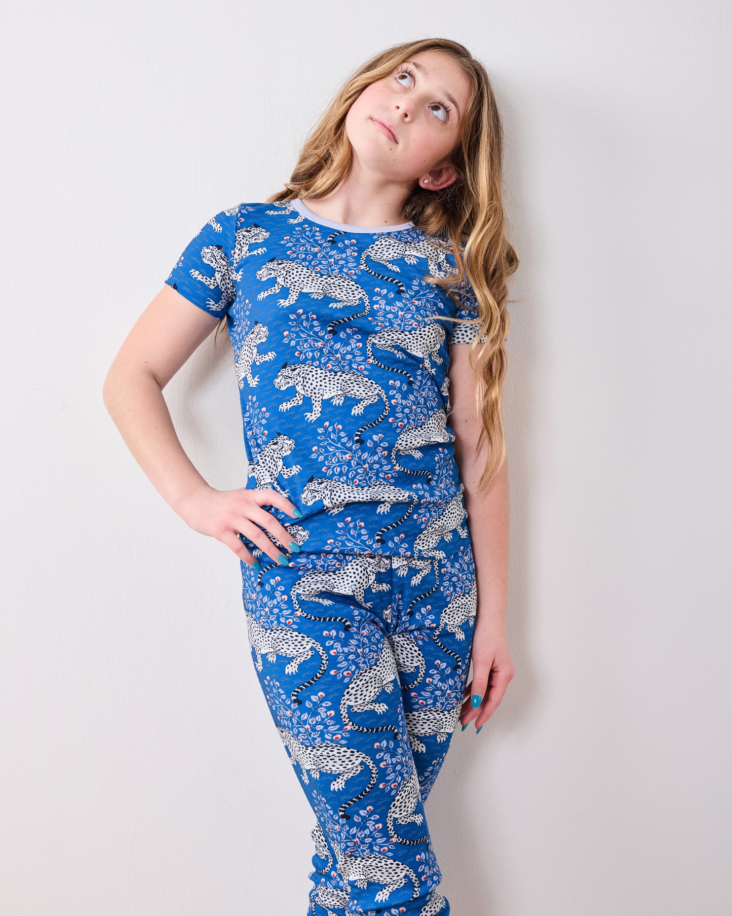 Front view of the indigo Bagheera short-sleeve top and pajama pants worn by a model