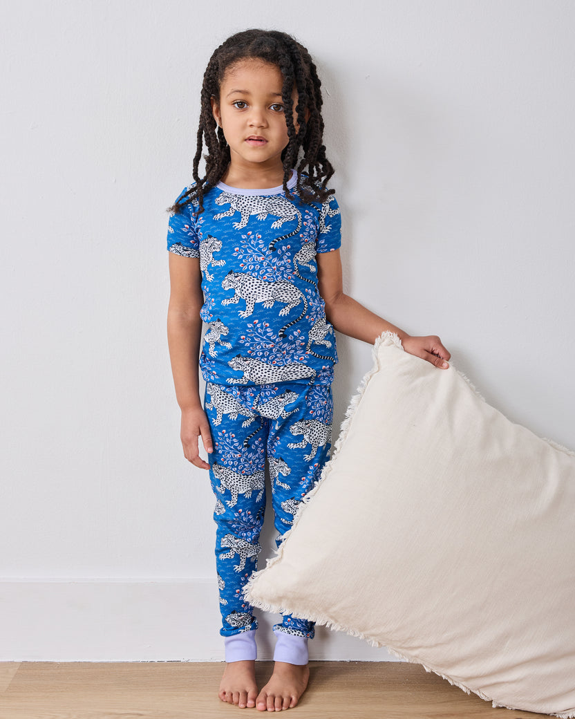 Full-length front view of a model wearing the indigo Bagheera short-sleeve pajama set
