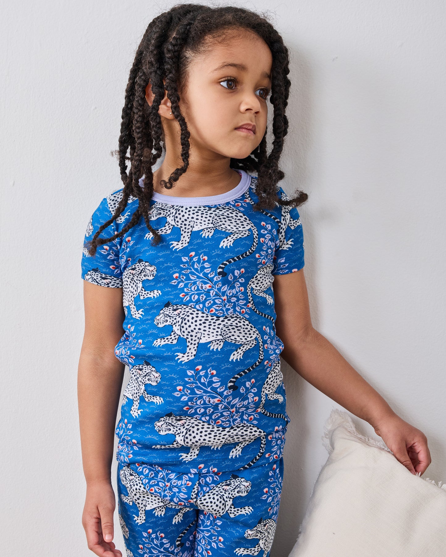 Closer front view of the indigo Bagheera short-sleeve pajama set worn by a model