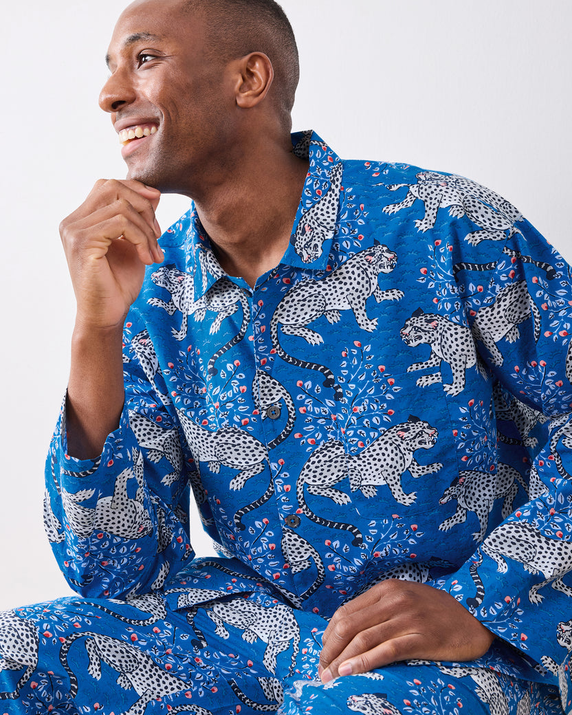 Seated model wearing the indigo Bagheera long pajama set, shown from the waist up