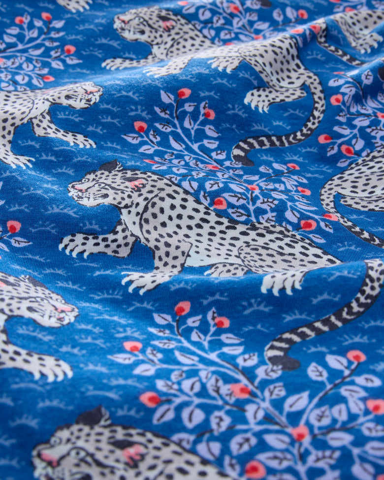 Close-up of the indigo Bagheera print with spotted cats and leafy branches