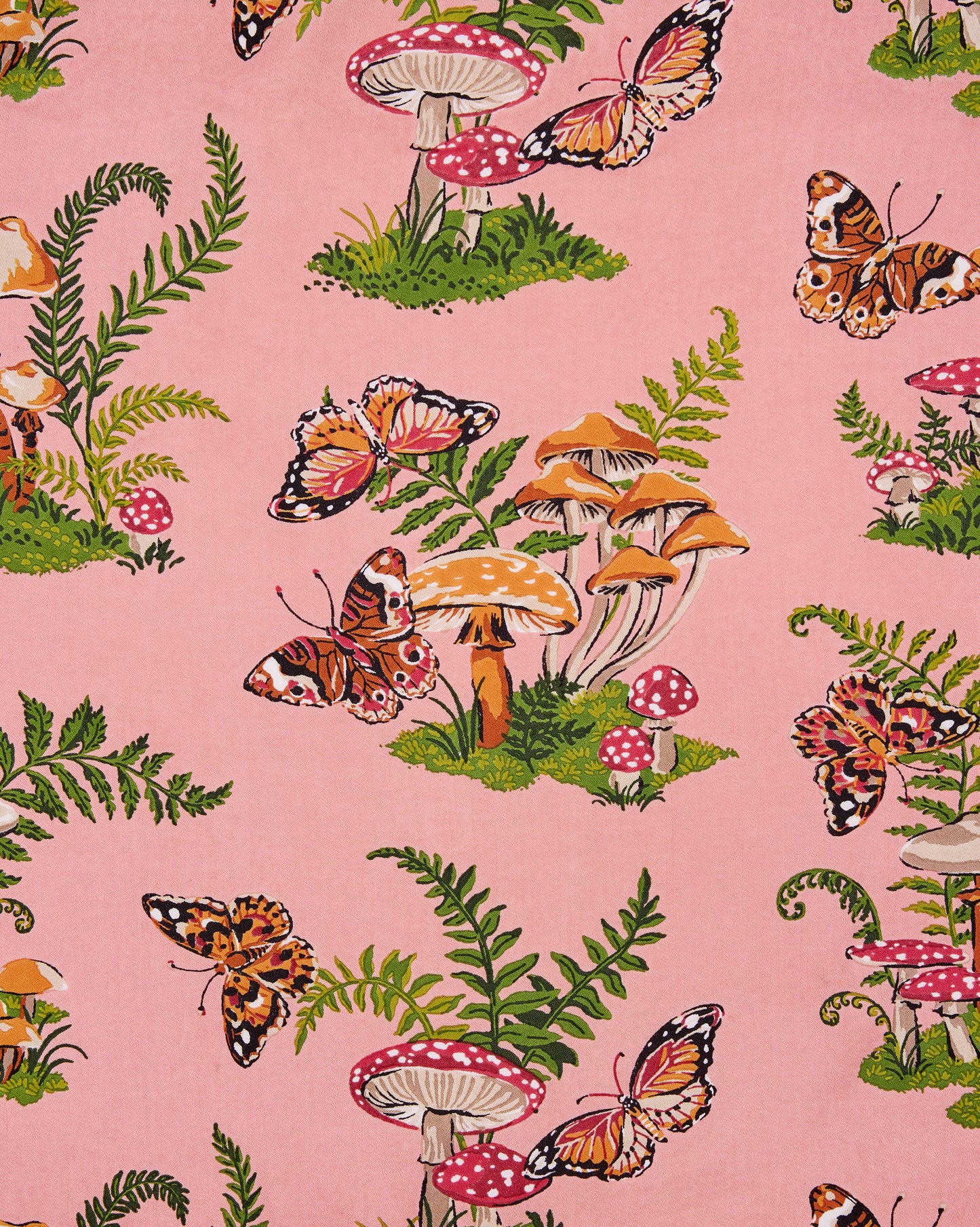 Close-up of the rosewood Butterfly Forager print, showing butterflies, mushrooms, and ferns on pink bag fabric.