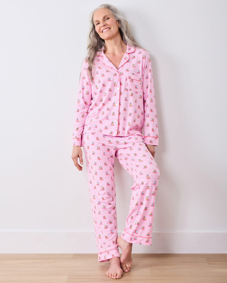 Full-length front view of a model wearing the pink Flamingo Floaties button-down long pajama set