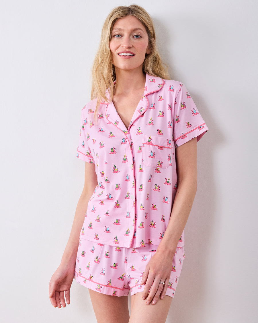 Front studio view of the pink flamingo-print button-down pajama top and matching shorts
