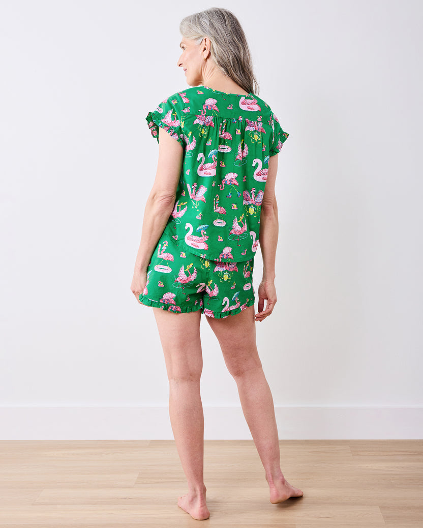 Back view of the green flamingo-print pintuck top and matching ruffled shorts