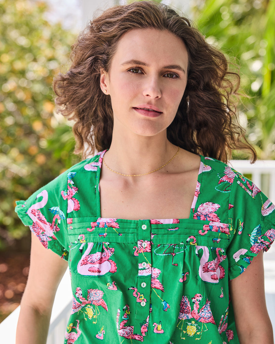 Close front view of the green flamingo-print pintuck pajama top