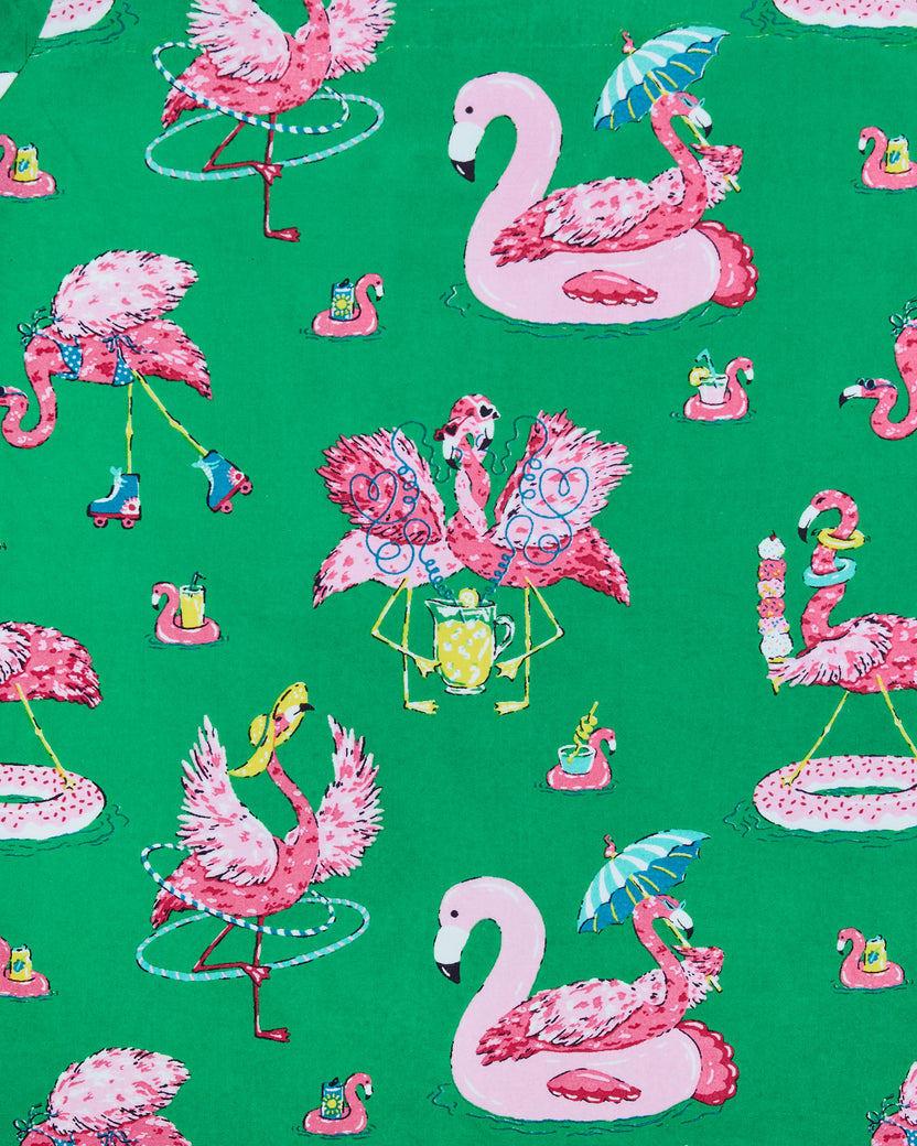 Palm Frond print with pink flamingos roller-skating, hula-hooping, floating, and holding drinks