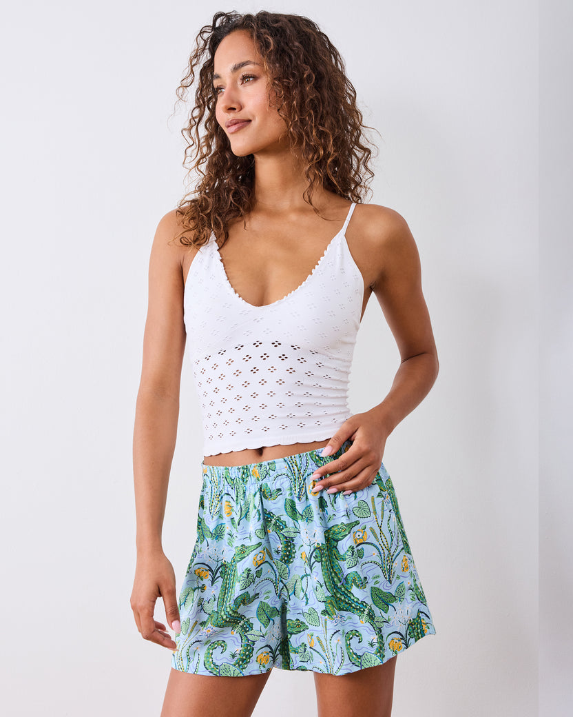 Front view of gator-print boxer shorts with an elastic waistband, styled with a white camisole