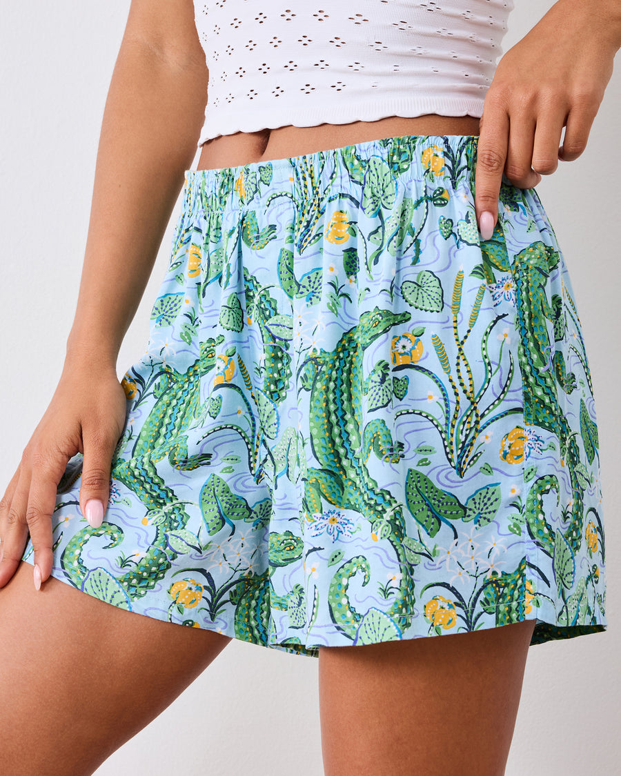 Close-up front view of the gator-print boxer shorts and gathered elastic waistband