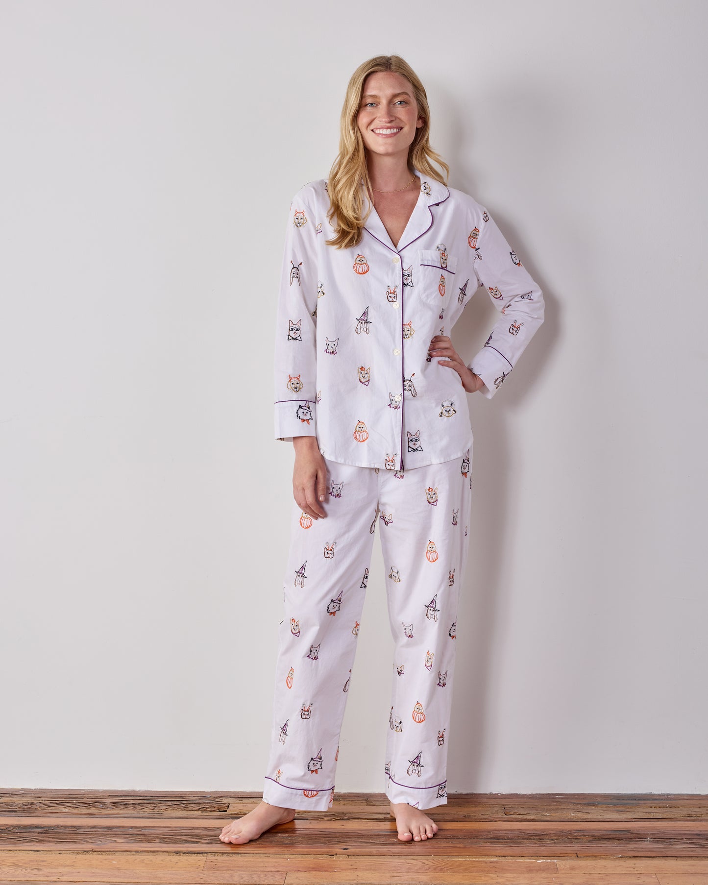Full-length front view of the Cloud Halloween Hounds petite long pajama set, showing the button-front top and matching dog-print pants.