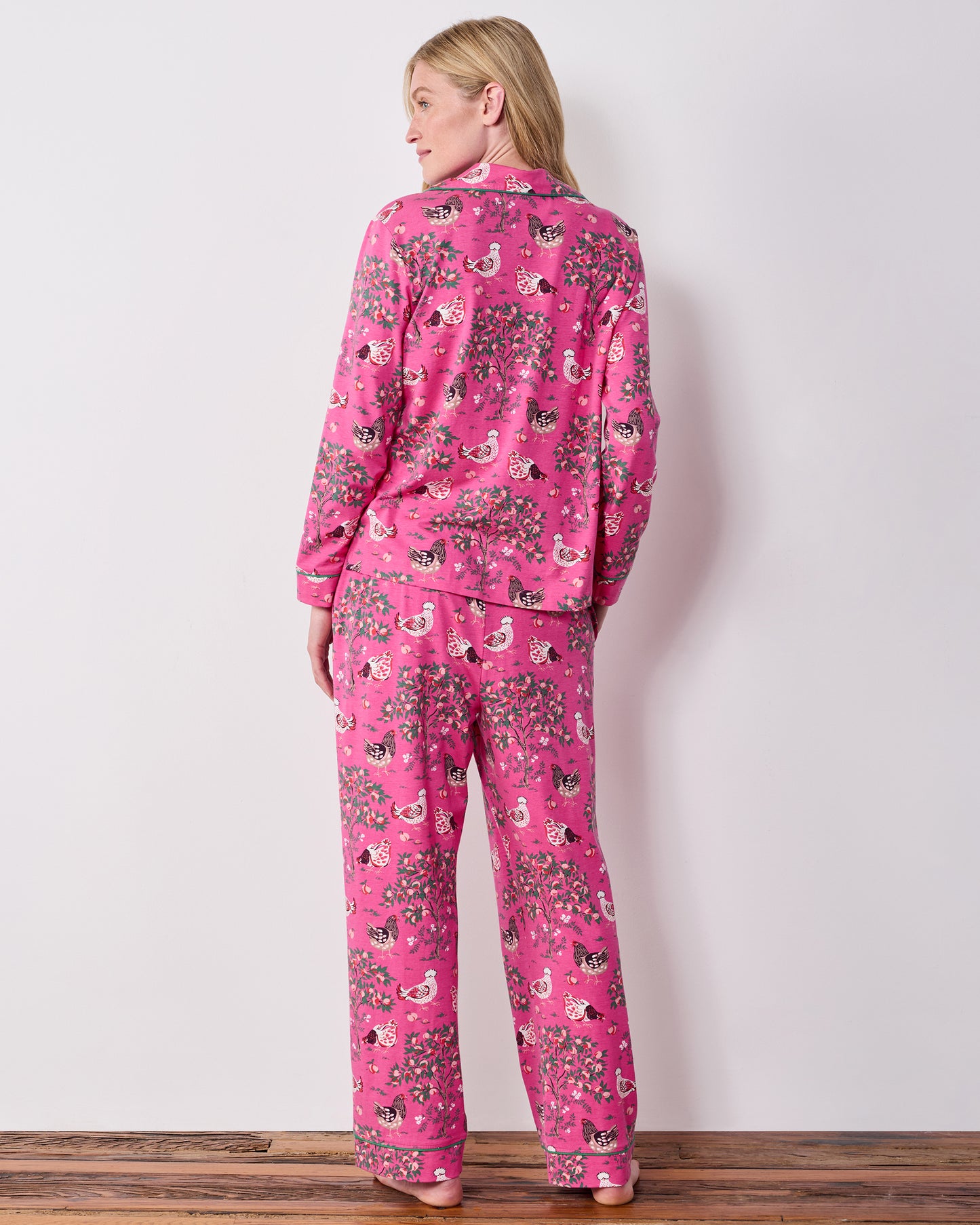 Back view of the Rose Pop Hen House long pajama set, showing the chicken-and-floral print on the button-down top and matching pants.