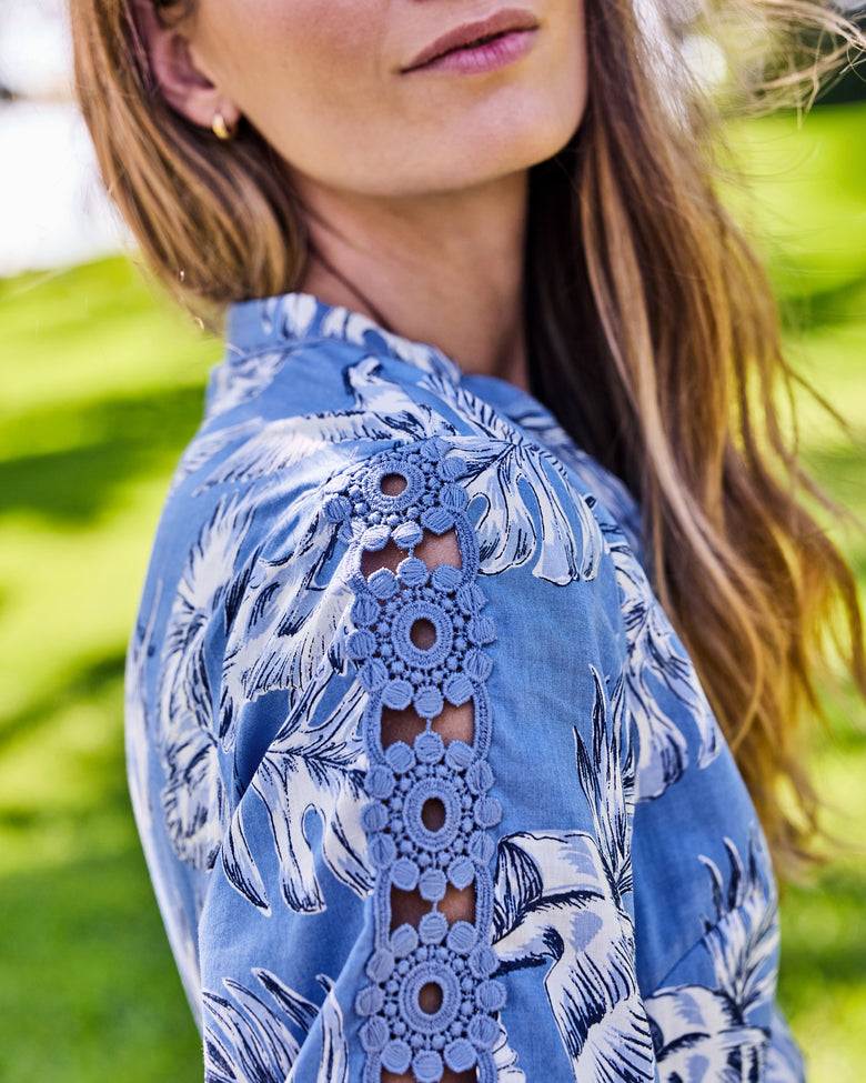 Close-up of the Monroe dress's shoulder and sleeve with an openwork floral lace insert