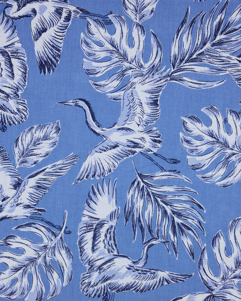 Saltwater blue Heron Landing print with white herons and large tropical leaves