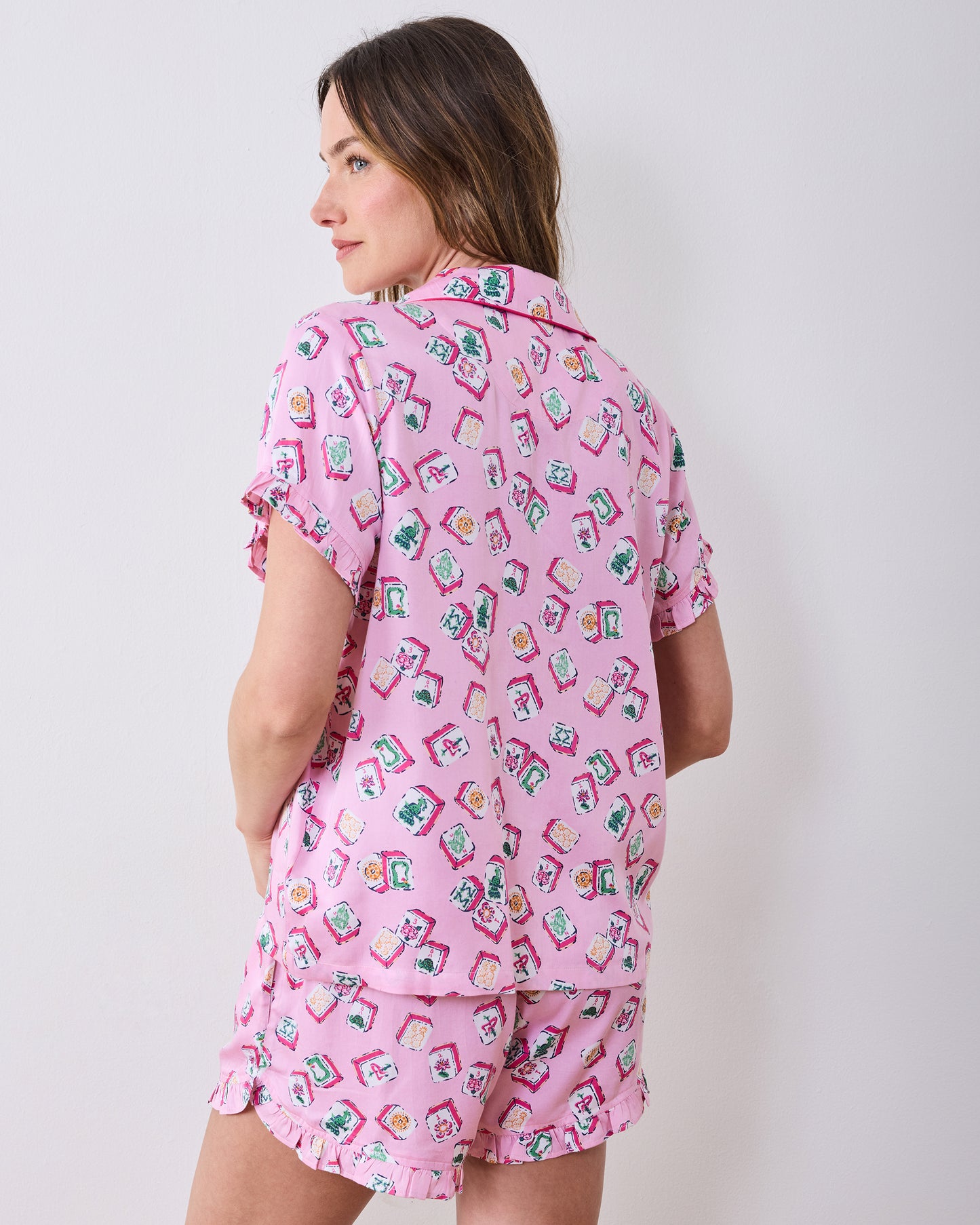 Back view of the Peony Pink Lucky Tiles short pajama set, showing the shirt and ruffle-trim shorts.