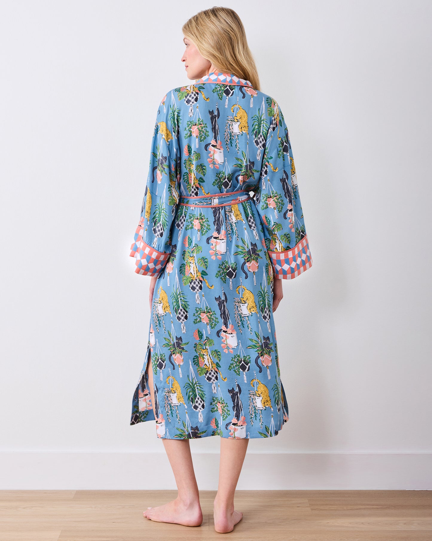 Full back view of the calf-length slate blue robe with belt and patterned cuffs