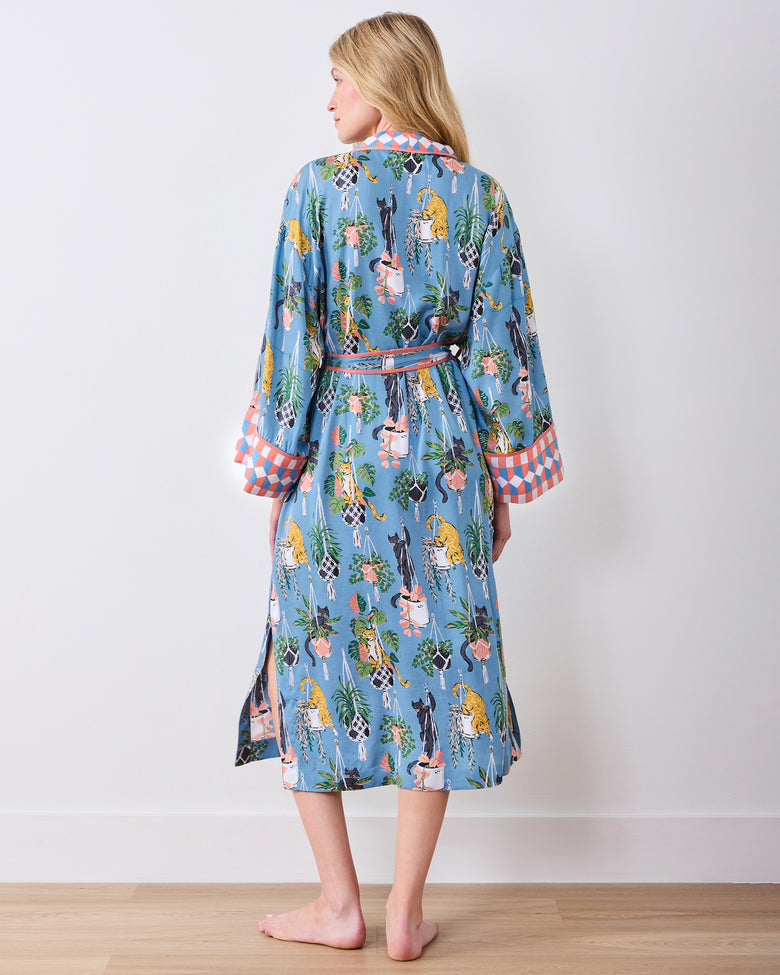 Full back view of the calf-length slate blue robe with belt and patterned cuffs
