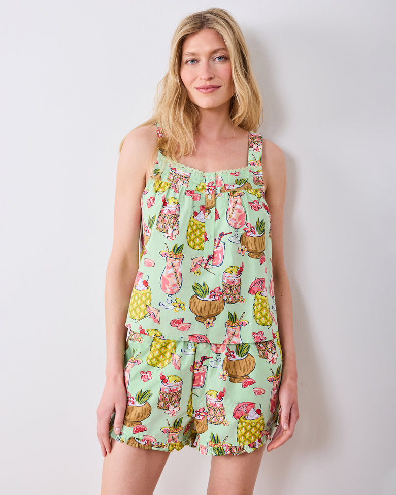 Front view of the Mojito sleeveless top and ruffled shorts set with tropical drink print