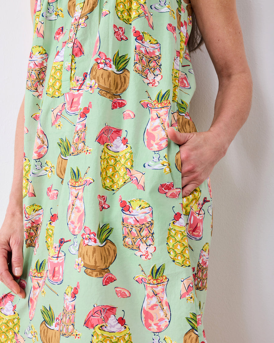 Close-up of the mint-green Paradise Punch nightgown showing its tropical drink print and side pocket