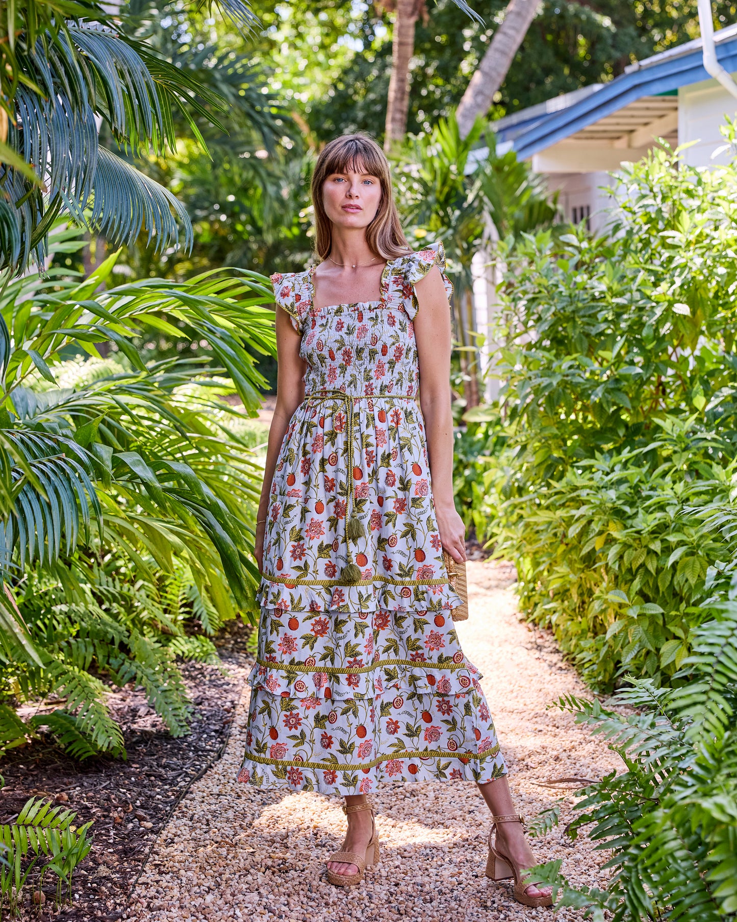 Full-length front view of the Billie Dress with a smocked bodice, tie belt, and tiered midi skirt