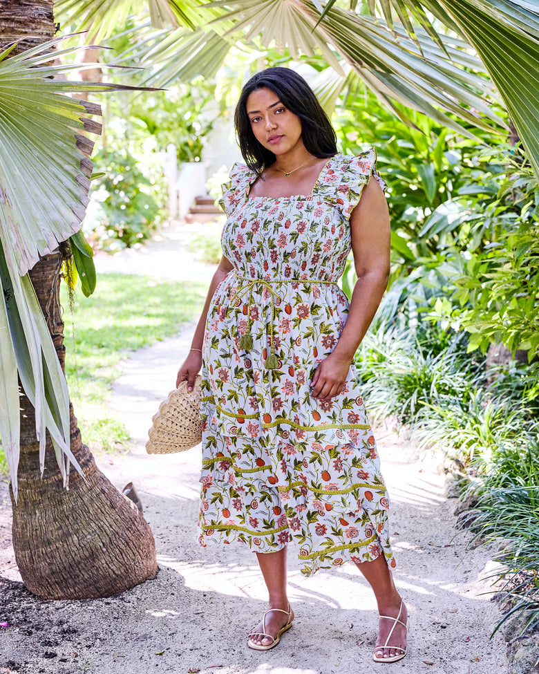Full-length front view of the Billie Dress with ruffled straps, tie belt, and tiered midi skirt