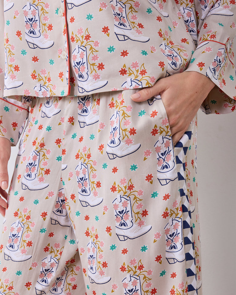 Close-up of the printed pajama top and pants, showing the pants pocket and contrasting geometric side panel.