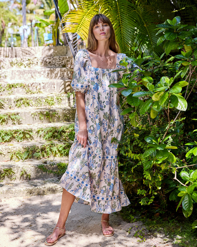 Full front view of the Saltwater Serenity Collins Dress with a square neckline, puff sleeves, and tiered long skirt