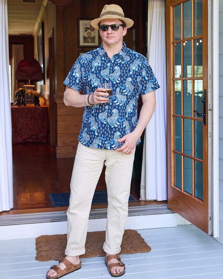 Full-length view of the Indigo tiger-print Leo Shirt styled with light trousers and sandals