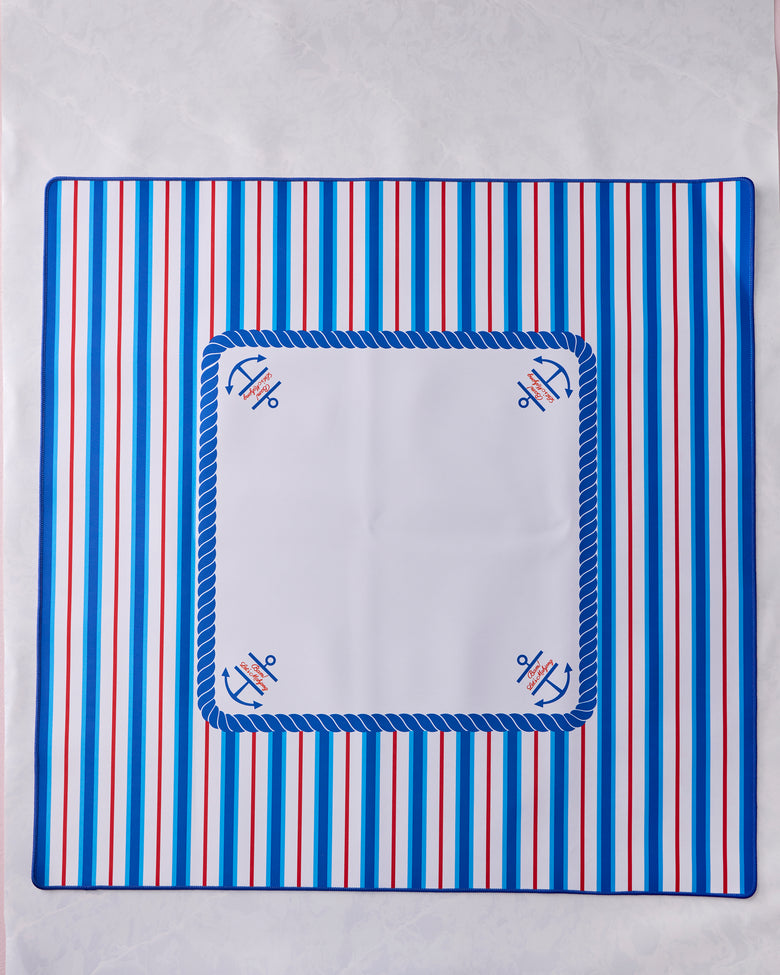 Nantucket mahjong mat with blue and red vertical stripes, a blue rope border, and anchor motifs at the corners.