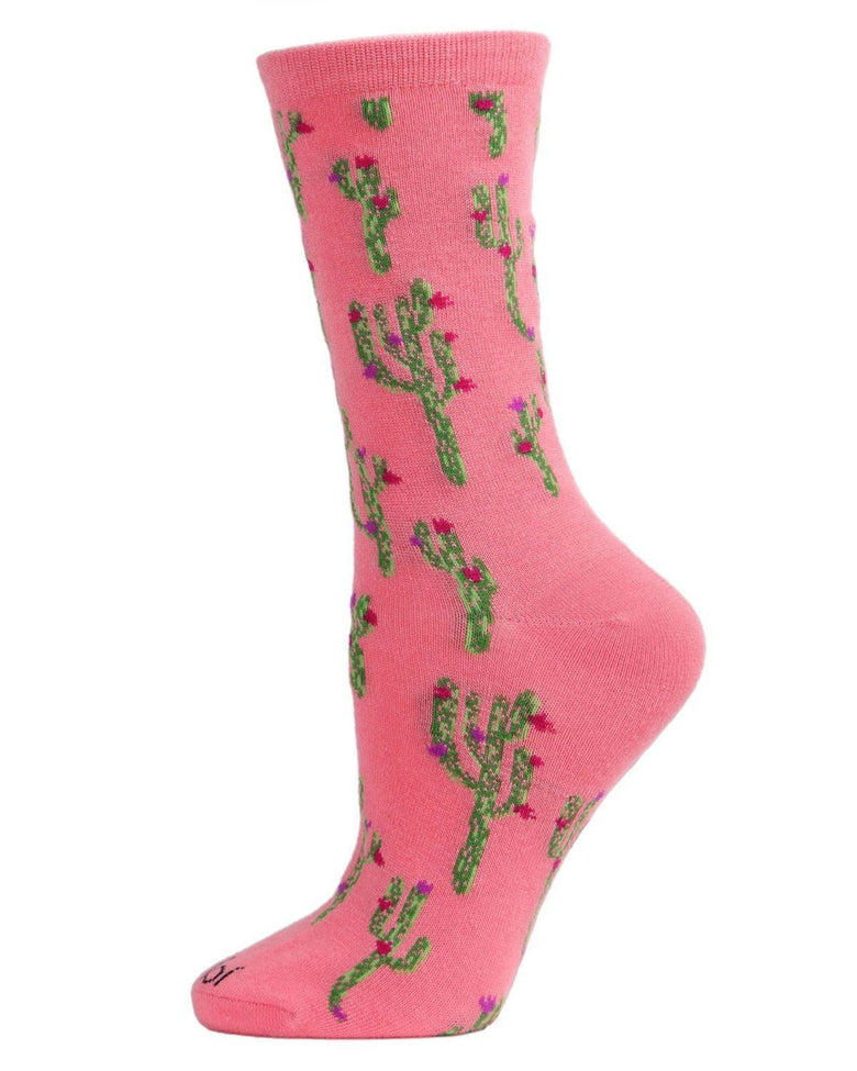 Confetti pink crew sock covered with green cactus illustrations accented by small pink flowers, shown from the side.