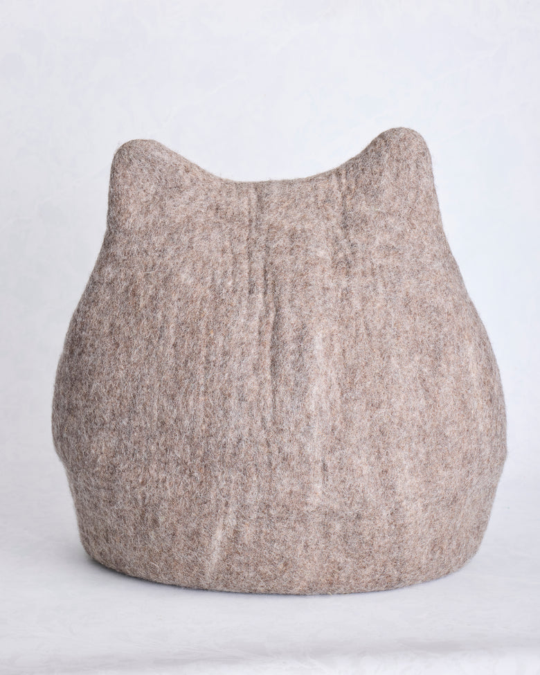 Front view of the taupe cat cave bed with pointed ears and stitched whisker details